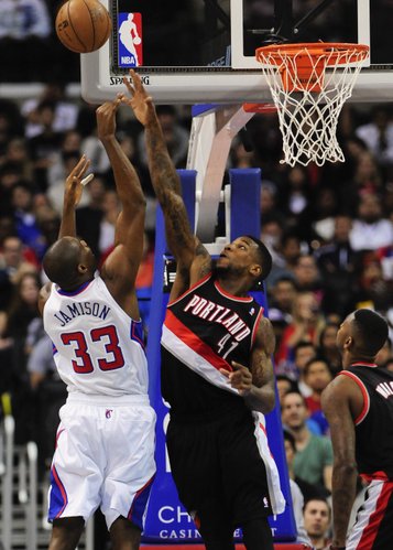Los Angeles Clippers forward Antawn Jamison (33) shoots over Portland Trail Blazers forward Thomas Robinson (41) in the first half of a pre-season NBA basketball game, Friday, Oct. 18, 2013, in Los Angeles.(AP Photo/Gus Ruelas)

