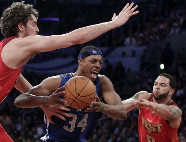 East's Paul Pierce, of the Boston Celtics, drives between West's Deron Williams, right, of the Utah Jazz, and Pau Gasol, of the Los Angeles Lakers, during the second half of the NBA basketball All-Star Game on Sunday, Feb. 20, 2011, in Los Angeles. (AP Photo/Jae C. Hong)

