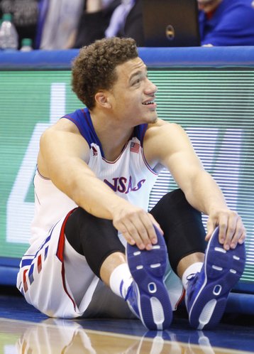 Kansas guard Brannen Greene stretches before entering the game during the second half on Friday, Nov. 22, 2013 at Allen Fieldhouse. Greene sat out in Tuesday's game against Iona.