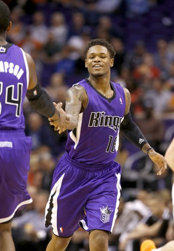 Sacramento Kings' Ben McLemore (16) shakes hands with teammate Jason Thompson during the second half of an NBA basketball game against the Phoenix Suns, Wednesday, Nov. 20, 2013, in Phoenix. The Kings won 113-106. (AP Photo/Ross D. Franklin) 