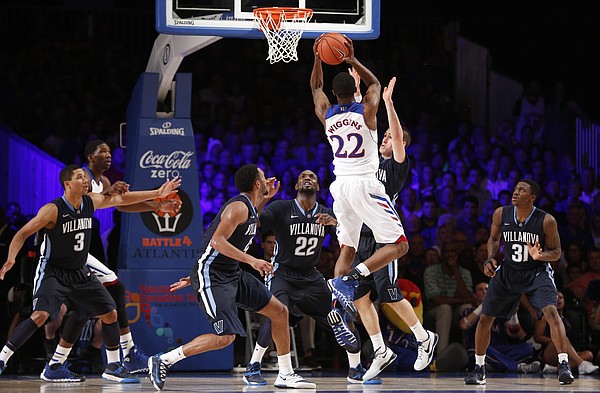 Kansas guard Andrew Wiggins hangs in the lane for a shot over the Villanova defense during the second half on Friday, Nov. 29, 2013 in Paradise Island, Bahamas.