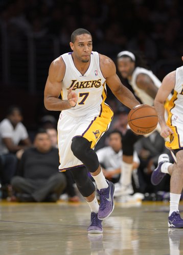 Los Angeles Lakers forward Xavier Henry dribble the ball during the first half of an NBA basketball game against the Sacramento Kings, Sunday, Nov. 24, 2013, in Los Angeles. (AP Photo/Mark J. Terrill)

