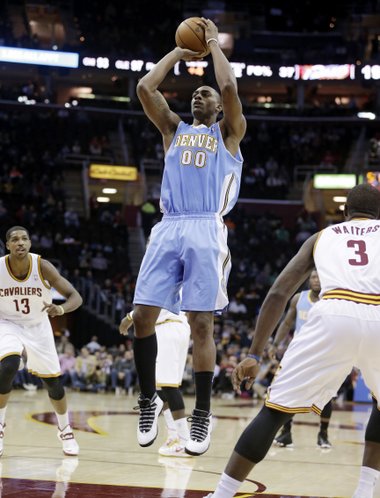 Denver Nuggets' Darrell Arthur (00) shoots against the Cleveland Cavaliers during an NBA basketball game Wednesday, Dec. 4, 2013, in Cleveland. (AP Photo/Tony Dejak)
