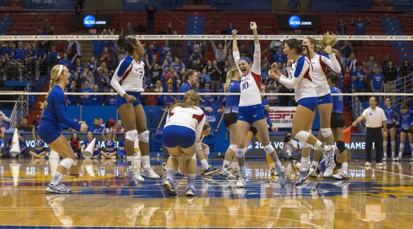 Kansas players celebrate their victory during their second round NCAA volleyball tournament match against Creighton, Saturday at Allen Fieldhouse. The Jayhawks downed the Bluejays, 3-1, and with the win, avenged a loss to Creighton earlier in the year.