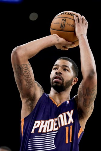 Phoenix Suns forward Markieff Morris shoots during the second half of an NBA basketball game against the Los Angeles Lakers in Los Angeles, Tuesday, Dec. 10, 2013. (AP Photo/Chris Carlson)