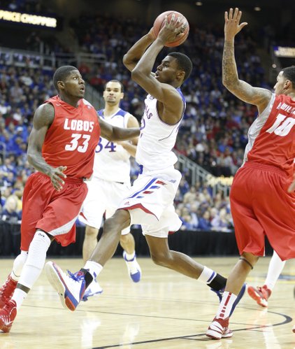 Kansas guard Andrew Wiggins drives to the bucket against New Mexico guard Deshawn Delaney during the first half on Saturday, Dec. 14, 2013 at Sprint Center in Kansas City, Mo.