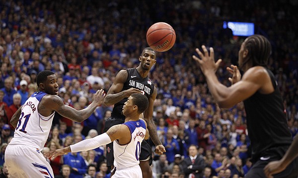 Kansas defenders Jamari Traylor and Frank Mason can't stop a pass from San Diego State forward Winston Shepard to Josh Davis during the second half on Sunday, Jan. 5, 2013 at Allen Fieldhouse.