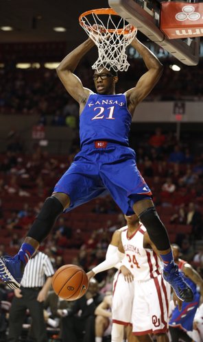 Kansas center Joel Embiid comes down from a dunk against Oklahoma during the first half on Wednesday, Jan. 8, 2013 at Lloyd Noble Center in Norman, Oklahoma.