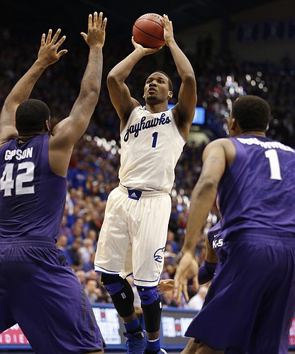 Kansas guard Wayne Selden floats into the lane for a shot before Kansas State defenders Thomas Gipson and Shane Southwell during the second half on Saturday, Jan. 11, 2013 at Allen Fieldhouse.