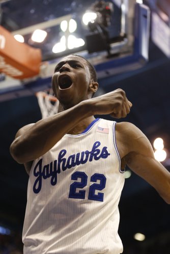 Kansas guard Andrew Wiggins celebrates after delivering on a breakaway dunk against Kansas State during the second half on Saturday, Jan. 11, 2014 at Allen Fieldhouse.