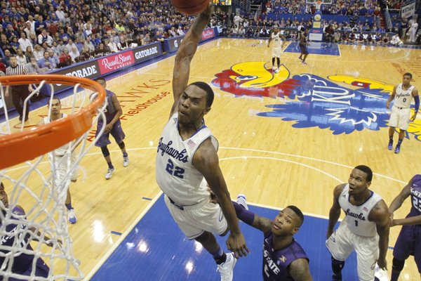 Kansas guard Andrew Wiggins gets up for a dunk over Kansas State guard Marcus Foster during the second half on Saturday, Jan. 11, 2013 at Allen Fieldhouse.