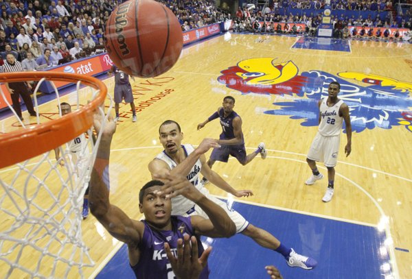 Kansas guard Perry Ellis and Kansas State guard Wesley Iwundu battle for a rebound during the second half on Saturday, Jan. 11, 2013 at Allen Fieldhouse.