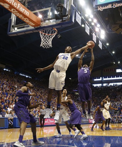 Kansas guard Andrew Wiggins battles for a rebound with Kansas State guard Jevon Thomas during the second half on Saturday, Jan. 11, 2014 at Allen Fieldhouse.