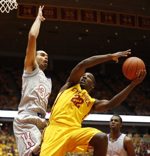 Kansas forward Perry Ellis defends against a shot from Iowa State forward Dustin Hogue during the first half on Monday, Jan. 13, 2014 at Hilton Coliseum in Ames, Iowa.