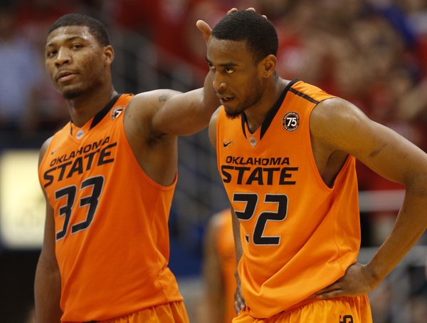 Oklahoma State guard Markel Brown (22) walks off the court after his second technical with teammate Marcus Smart during the second half on Saturday, Jan. 18, 2014 at Allen Fieldhouse.