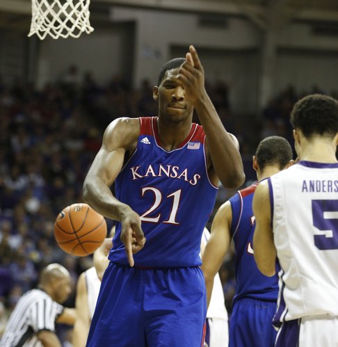 Kansas center Joel Embiid fires off a couple of "pistols" in celebration after finishing a bucket after a TCU foul during the first half on Saturday, Jan. 25, 2014 at Daniel-Meyer Coliseum in Fort Worth, Texas.