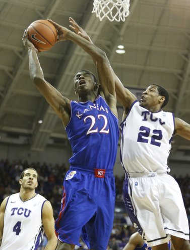 Kansas guard Andrew Wiggins gets a put-back bucket against TCU guard Jarvis Ray during the second half on Saturday, Jan. 25, 2014 at Daniel-Meyer Coliseum in Fort Worth, Texas.