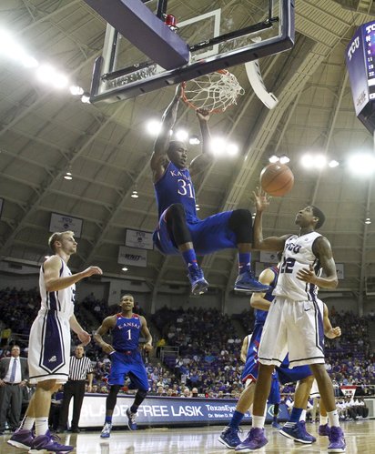 Kansas forward Jamari Traylor dunks over TCU guard Jarvis Ray (22) during the second half on Saturday, Jan. 25, 2014 at Daniel-Meyer Coliseum in Fort Worth, Texas.