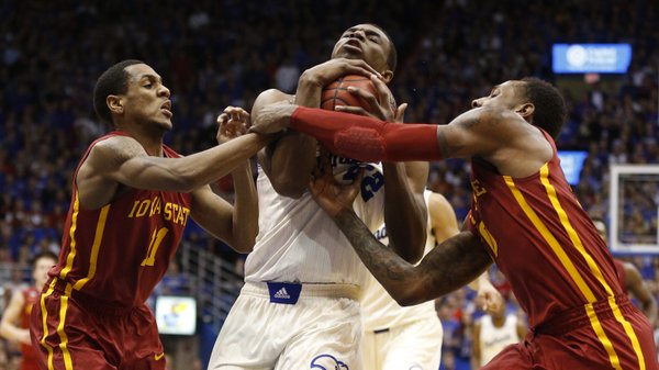 Kansas guard Andrew Wiggins drives to the bucket between Iowa State players Monte Morris, left, and DeAndre Kane during the second half on Wednesday, Jan. 29, 2014 at Allen Fieldhouse.