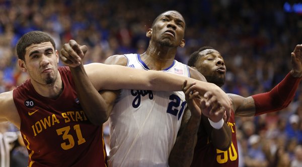 Kansas center Joel Embiid battles for position with Iowa State defenders Georges Niang, left, and DeAndre Kane during the second half on Wednesday, Jan. 29, 2014 at Allen Fieldhouse.