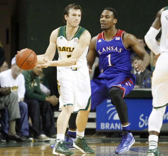 Kansas guard Wayne Selden (1) defends Baylor guard Brady Heslip (5) tight during the second half of the Jayhawks' 69-52 win over the Bears Tuesday, Feb. 4, 2014 at Ferrell Center in Waco, Texas.