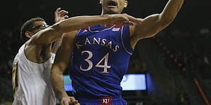 Kansas forward Perry Ellis puts up a shot against Baylor center Isaiah Austin during the first half on Tuesday, Feb. 4, 2014 at Ferrell Center in Waco, Texas.