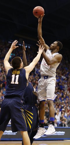 Kansas guard Andrew Wiggins puts up a shot against the West Virginia defense during the first half on Saturday, Feb. 8, 2014 at Allen Fieldhouse.