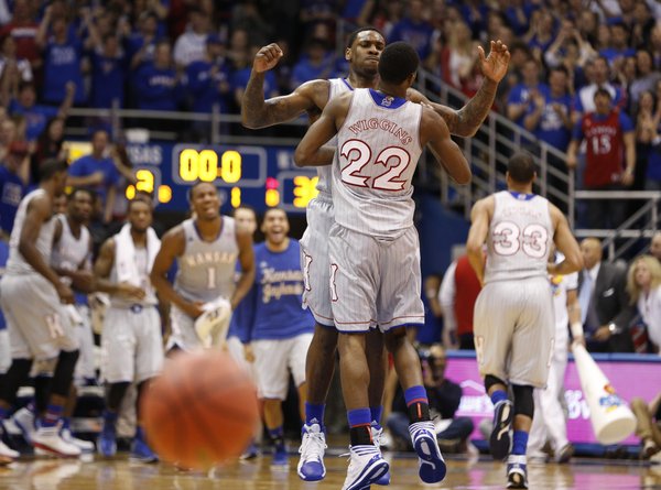 Kansas forward Tarik Black chest bumps teammate Andrew Wiggins after Wiggins finished the first half with a put-back dunk against West Virginia on Saturday, Feb. 8, 2014 at Allen Fieldhouse.