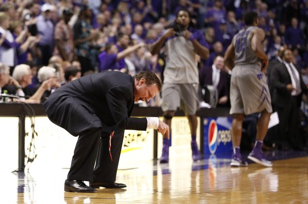 Kansas head coach Bill Self points to the floor while disputing a traveling call against forward Perry Ellis during the second half on Monday, Feb. 10, 2014 at Bramlage Coliseum.