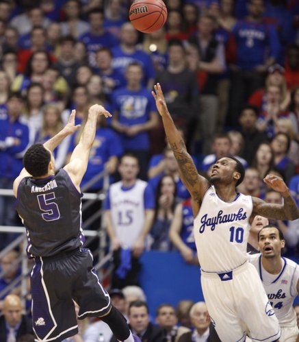 Kansas guard Naadir Tharpe defends as TCU guard Kyan Anderson pulls back for a shot during the first half on Saturday, Feb. 15, 2014 at Allen Fieldhouse.