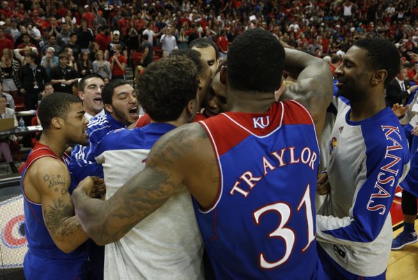 Kansas players mob Andrew Wiggins after Wiggins' last-second bucket lifted the Jayhawks over Texas Tech, 64-63 on Tuesday, Feb. 18, 2014 at United Spirit Arena in Lubbock, Texas.