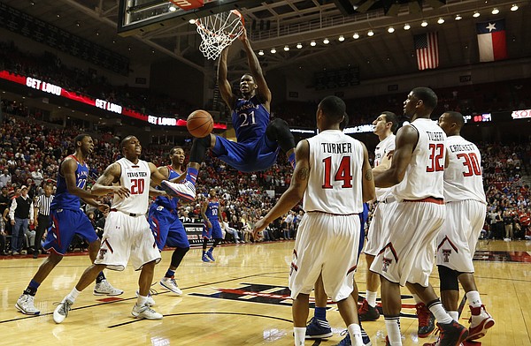 Kansas center Joel Embiid delivers a dunk against Texas Tech to give the Jayhawks the lead with less than 30 seconds on Tuesday, Feb. 18, 2014 at United Spirit Arena in Lubbock, Texas.