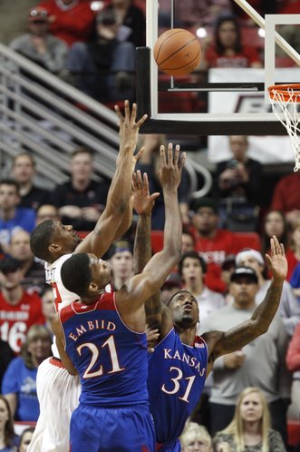 Kansas players Joel Embiid and Jamari Traylor defend a shot from Texas Tech forward Jordan Tolbert during the second half on Tuesday, Feb. 18, 2014 at United Spirit Arena in Lubbock, Texas.