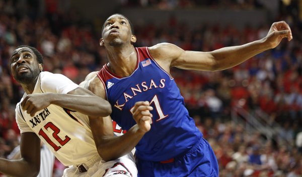 Kansas center Joel Embiid battles for position against Texas Tech forward Kader Tapsoba during the second half on Tuesday, Feb. 18, 2014 at United Spirit Arena in Lubbock, Texas.