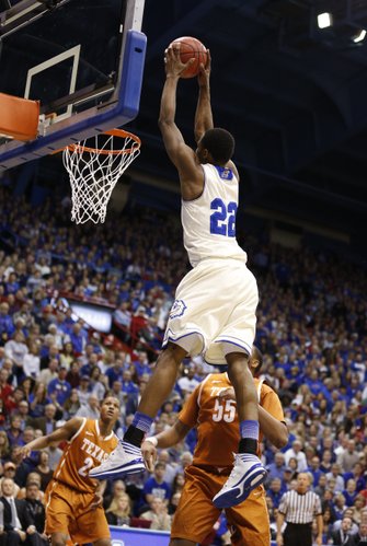 Kansas guard Andrew Wiggins catches a pass well above the rim for a dunk against Texas during the first half on Saturday, Feb. 22, 2014 at Allen Fieldhouse.