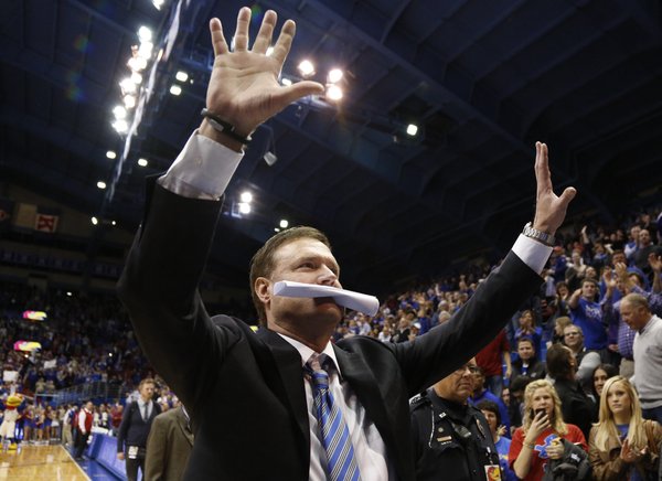 Kansas head coach Bill Self raises up two palms in light of the the Jayhawks' tenth-straight conference title following their 83-75 win over Oklahoma on Monday, Feb. 24, 2014 at Allen Fieldhouse.