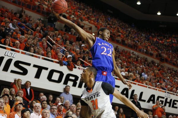 Kansas guard Andrew Wiggins tries to save a loose ball from going out-of-bounds over Oklahoma State forward Kamari Murphy during the first half on Saturday, March 1, 2014 at Gallagher-Iba Arena in Stillwater, Oklahoma.