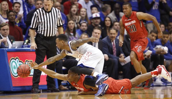 Kansas guard Naadir Tharpe and Texas Tech guard Randy Onwuasor chase a loose ball during the first half on Wednesday, March 5, 2014 at Allen Fieldhouse.