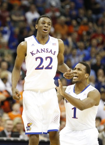 Kansas guard Andrew Wiggins (22) celebrates a dunk with teammate Wayne Selden against Oklahoma State late in the second half on Thursday, March 13, 2014 at Sprint Center in Kansas City, Missouri.