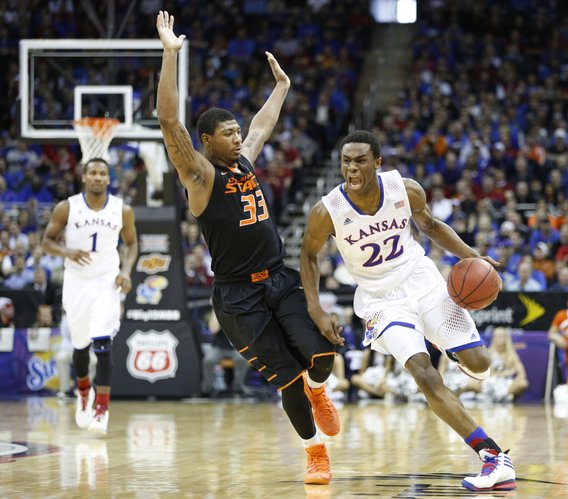 Kansas guard Andrew Wiggins drives against Oklahoma State guard Marcus Smart during the second half on Thursday, March 13, 2014 at Sprint Center in Kansas City, Missouri.