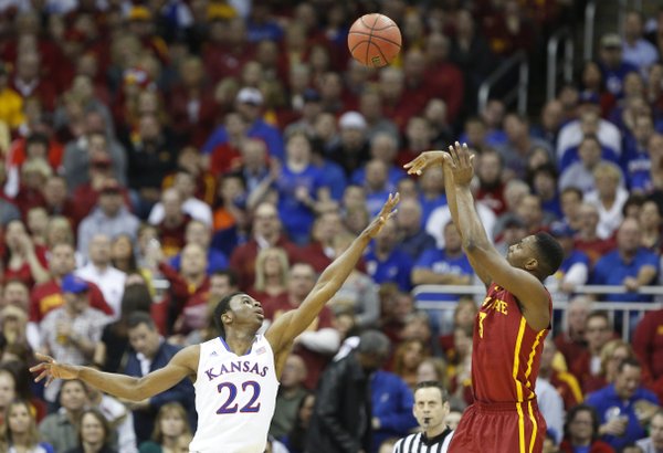 Iowa State forward Melvin Ejim pulls up for a shot over Kansas guard Andrew Wiggins during the first half on Friday, March 14, 2014 at Sprint Center in Kansas City, Missouri.
