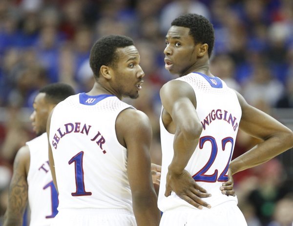 Frustrated, Kansas guard Andrew Wiggins turns back toward an official wanting a foul called during a break along side teammate Wayne Selden in the first half on Friday, March 14, 2014 at Sprint Center in Kansas City, Missouri.