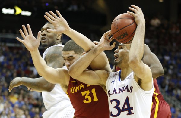 Kansas forward Perry Ellis works his way to the bucket against Iowa State forward Georges Niang during the second half on Friday, March 14, 2014 at Sprint Center in Kansas City, Missouri.