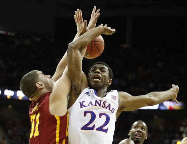 Kansas guard Andrew Wiggins loses the ball as he is fouled by Iowa State forward Georges Niang during the first half on Friday, March 14, 2014 at Sprint Center in Kansas City, Missouri.