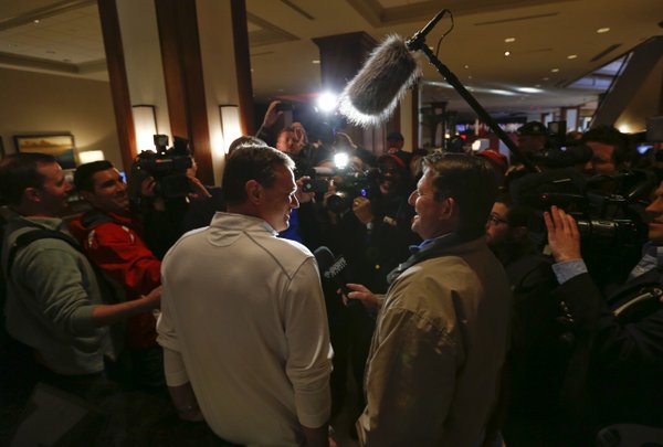Kansas head coach Bill Self laughs with media members as he stops for questions following the Jayhawks' arrival at the Hyatt Regency hotel at the Arch, Wednesday, March 19, 2014, in St. Louis. The Jayhawks play their first game of the NCAA Tournament on Friday.