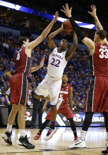 Kansas guard Andrew Wiggins puts a shot between Stanford defenders Stefan Nastic, left, and Dwight Powell during the first half on Sunday, March 23, 2014 at Scottrade Center in St. Louis.