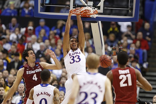 Kansas forward Landen Lucas dunks past Stanford forward Stefan Nastic during the second half on Sunday, March 23, 2014 at Scottrade Center in St. Louis.