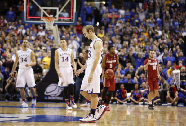 Kansas guard Conner Frankamp walks off the court after missing a three with seconds remaining against Stanford on Sunday, March 23, 2014 at Scottrade Center in St. Louis.