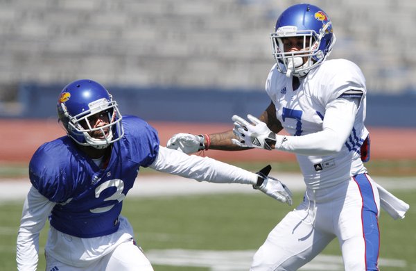Kansas wide receiver Tony Pierson, (3) goes against cornerback Kevin Short (7) in drills during a KU football practice Saturday, April 5, 2014, at Memorial Stadium.