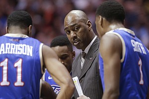 Tulsa coach Danny Manning, center, talks to players during a timeout against UCLA in a second-round game in the NCAA men's college basketball tournament Friday, March 21, 2014, in San Diego.